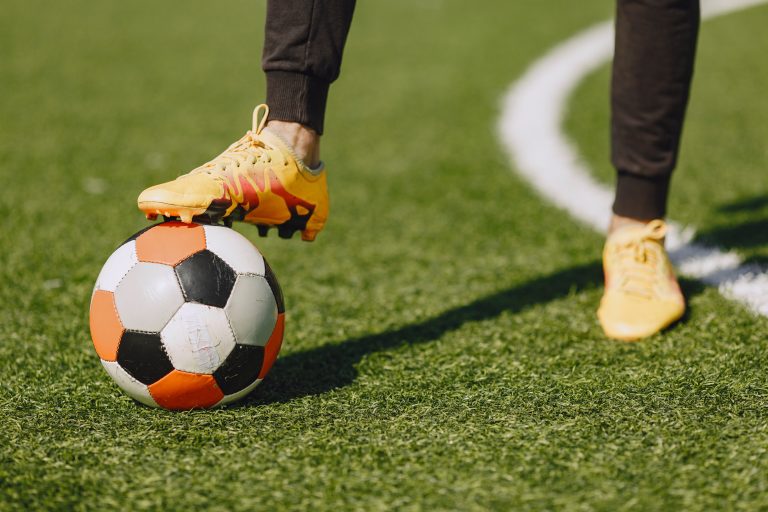 Sporman is playing football and practising with the ball